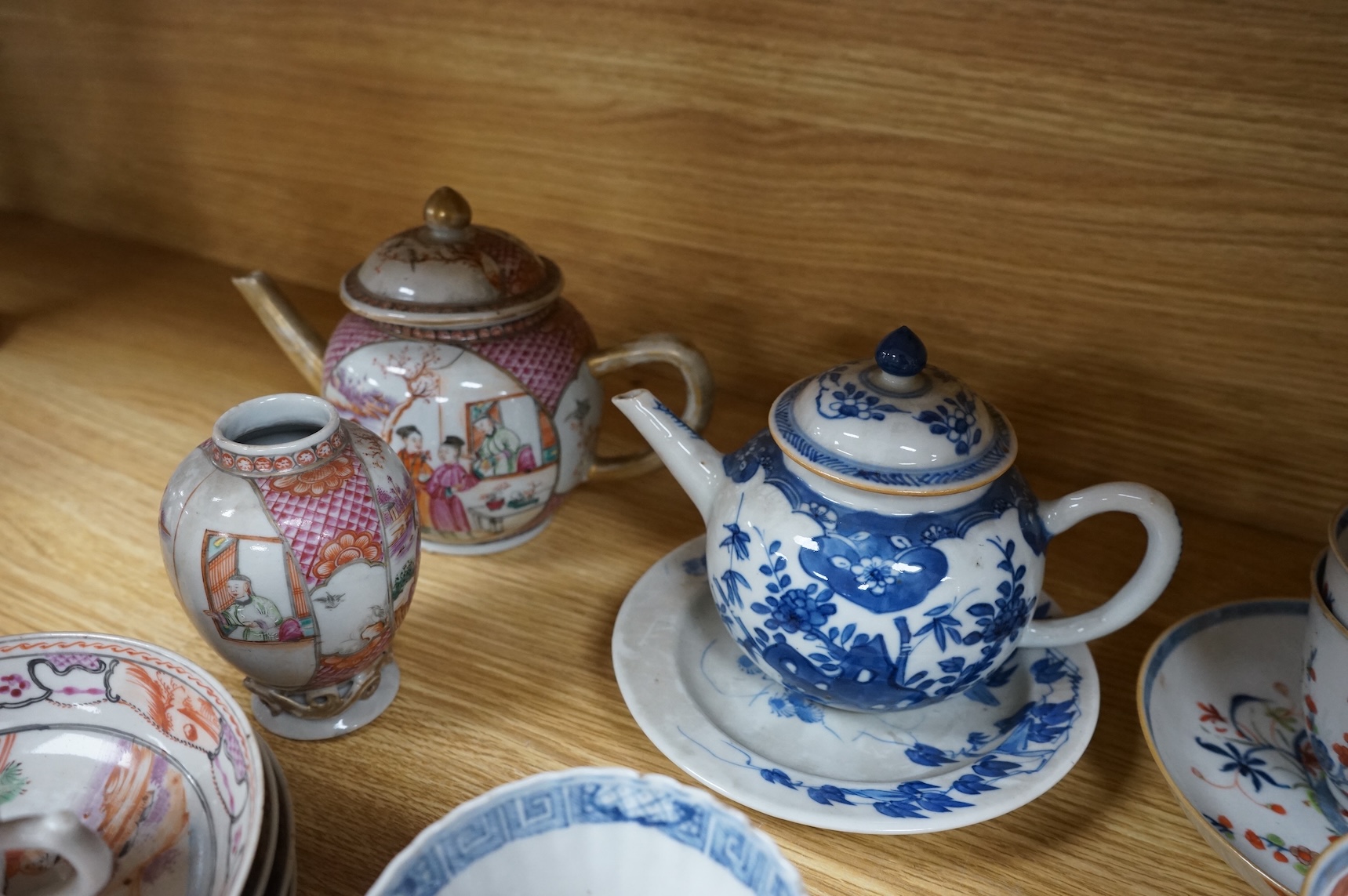 A group of 18th century Chinese export porcelain tea and coffee ware, including Mandarin pattern teapot and cover, two coffee cups and saucers, a blue and white teapot and cover various famille rose coffee cups, etc.